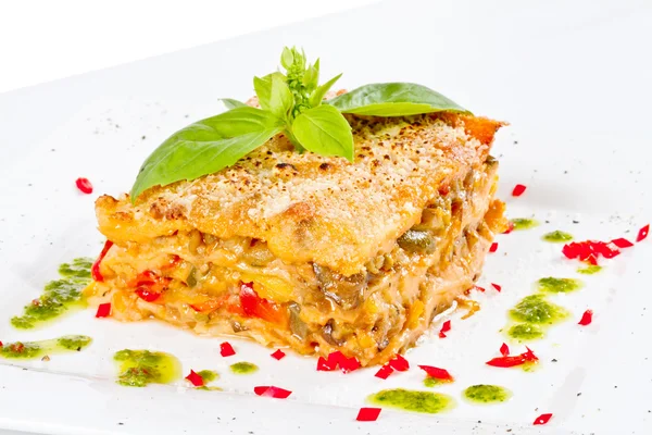 Stock image Closeup of lasagna and basil fork