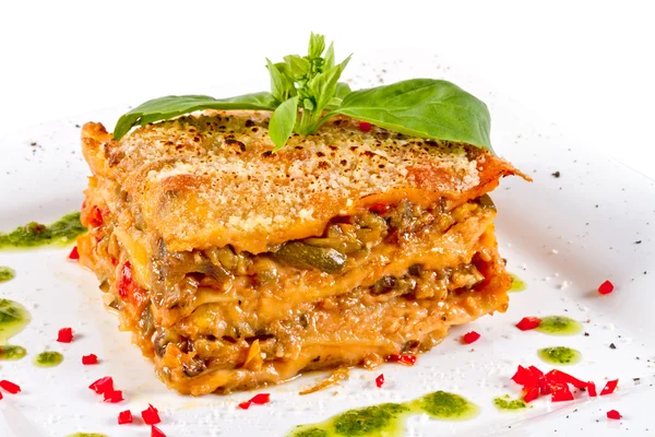 Stock image Closeup of lasagna and basil fork