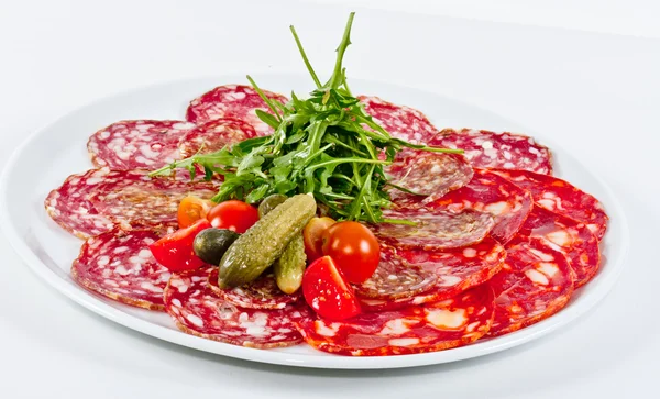 stock image Italian sausage assorted with tomato, cucumber and ruccola