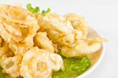 Golden deep fried onion rings clipart