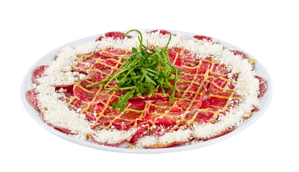 stock image Meat (beef) Carpaccio with Parmesan Cheese and ruccola