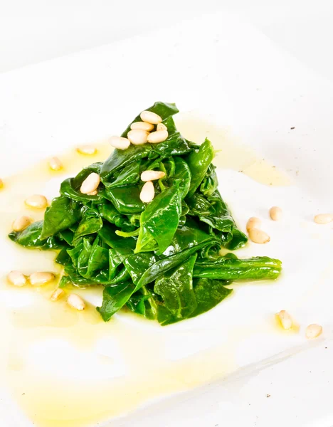 Dish of the spinach with cedar nut — Stock Photo, Image