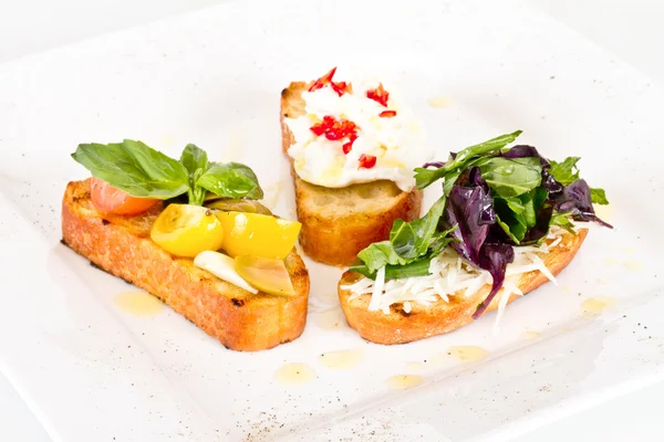 stock image Different colored Canapes on a white background