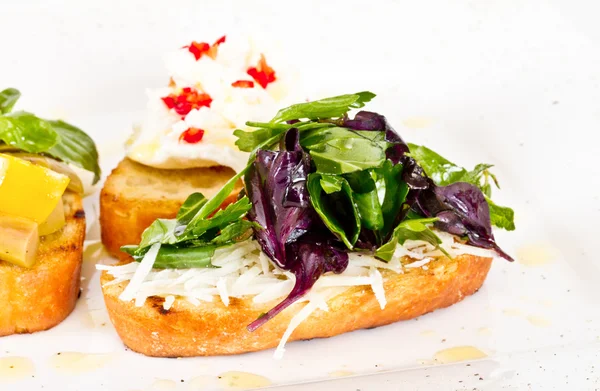 stock image Different colored Canapes on a white background