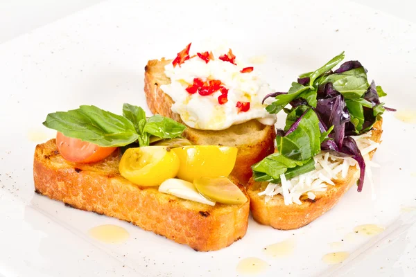 stock image Different colored Canapes on a white background