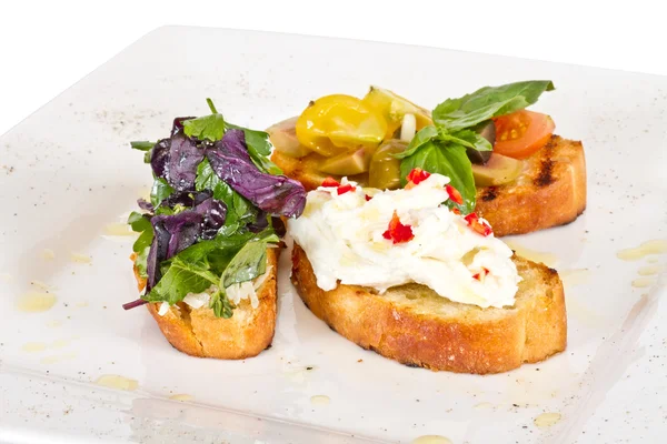 stock image Different colored Canapes on a white background