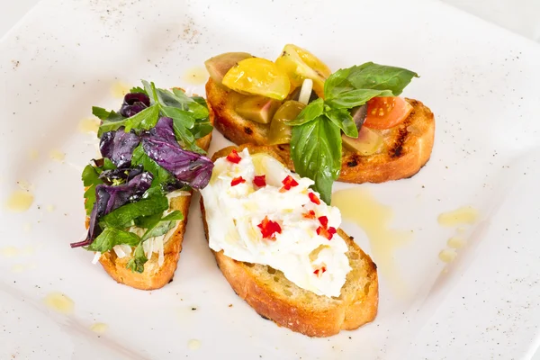 stock image Different colored Canapes on a white background