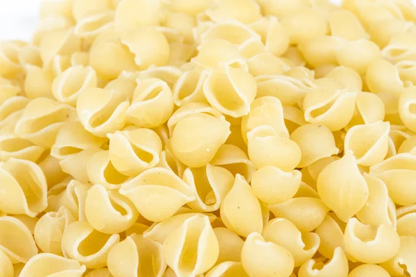 stock image Heap of raw pasta (conchiglie)