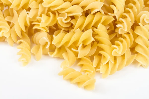 En del av rotini korkskruvsformade pasta isolerad på vit. — Stockfoto