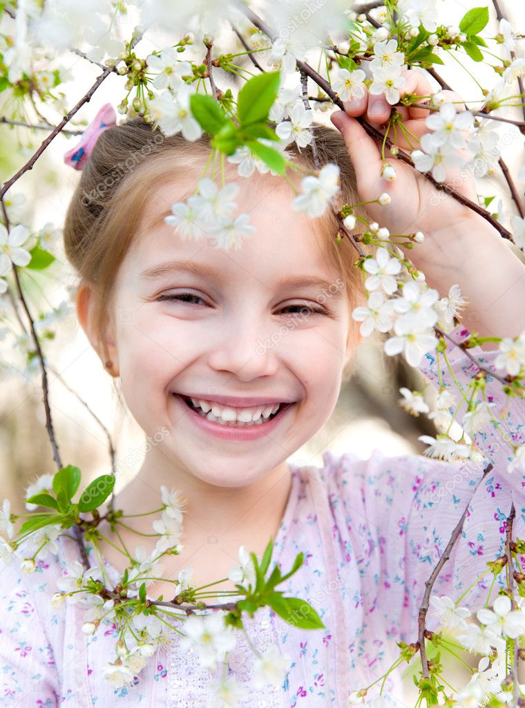 Little girl with bush blossoming Stock Photo by ©tan4ikk 10238173