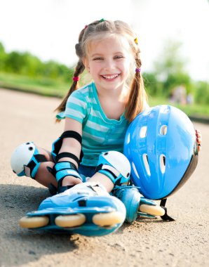 Little girl in roller skates clipart