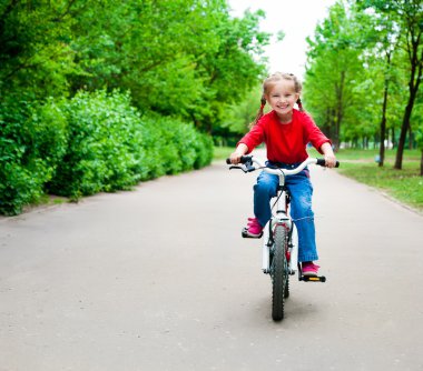 Girl with bicycle clipart