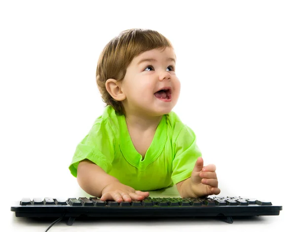 Criança segurando teclado — Fotografia de Stock