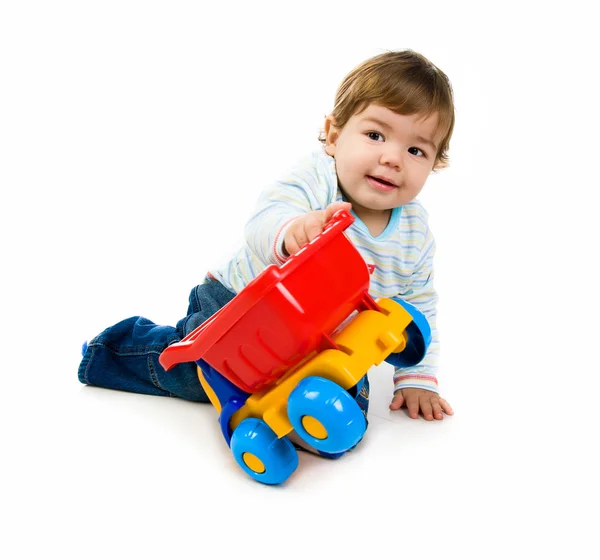 Niño pequeño con un coche grande — Foto de Stock