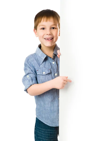 Kind achter een bord — Stockfoto