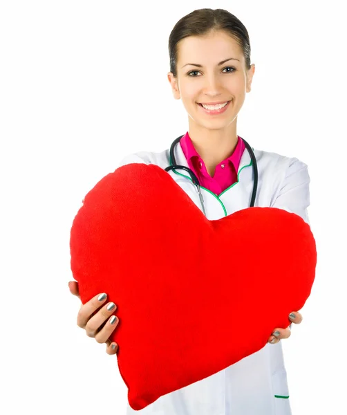 Médico cuidando de simbolismo coração vermelho — Fotografia de Stock