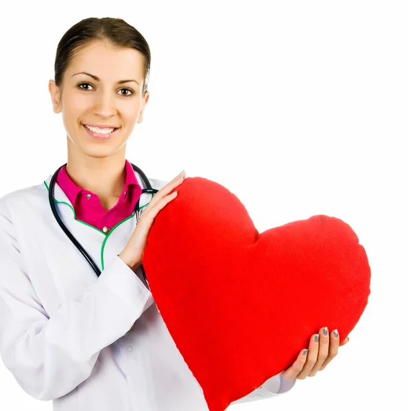 Médico cuidando de simbolismo coração vermelho — Fotografia de Stock