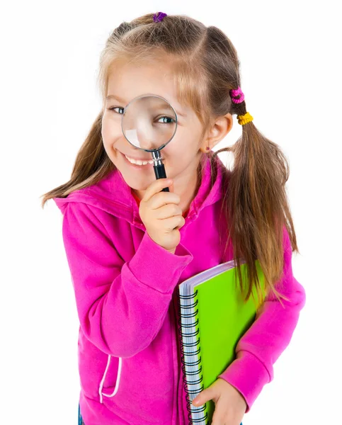 Girl looking through a magnifying glass — Stock Photo, Image