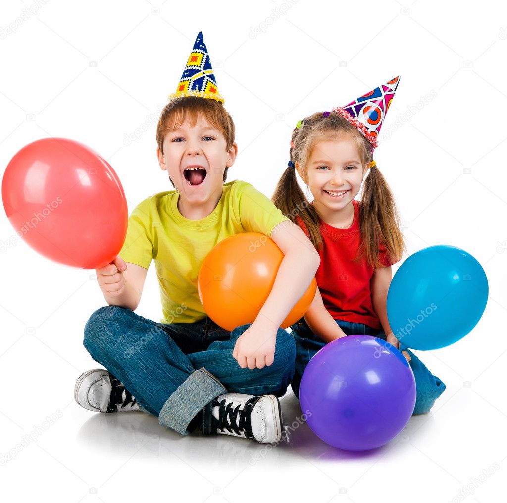 Kids in birthday caps