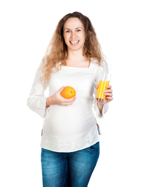 Pregnant woman with pretty stomach holding orange Royalty Free Stock Images