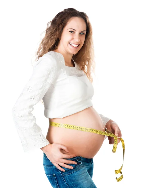 Gravid kvinna mäter magen — Stockfoto