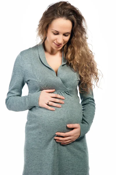 Gravid kvinna smeker magen — Stockfoto