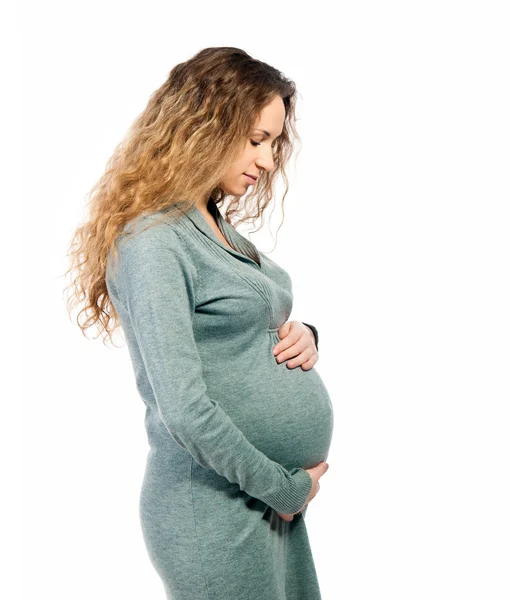 Femme enceinte caressant son ventre — Photo