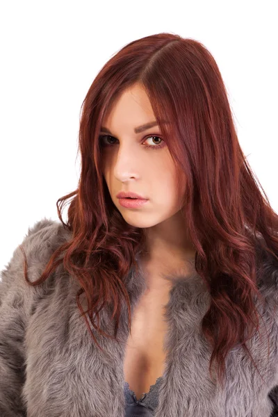 The young beautiful girl in a fur coat — Stock Photo, Image