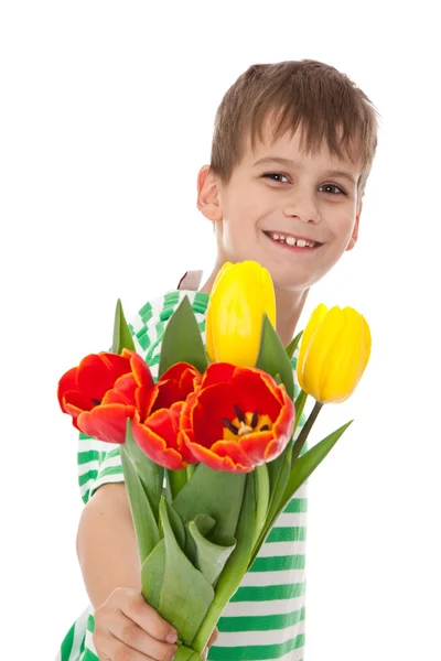 Młody chłopak gospodarstwa tulipany — Zdjęcie stockowe