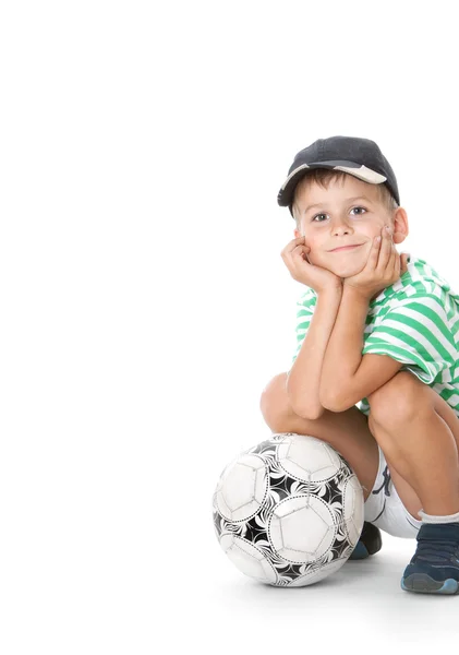 Menino segurando bola de futebol — Fotografia de Stock