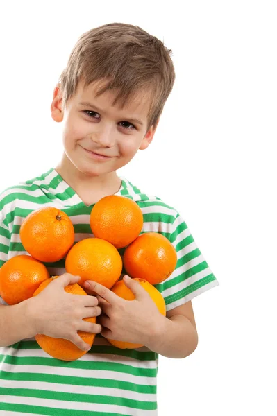 Boy holding oranges — Stock Photo, Image