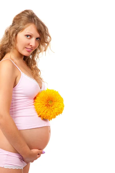 Zwangere vrouw is streelde haar buik — Stockfoto