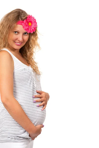 Těhotná žena je laskal její břicho — Stock fotografie