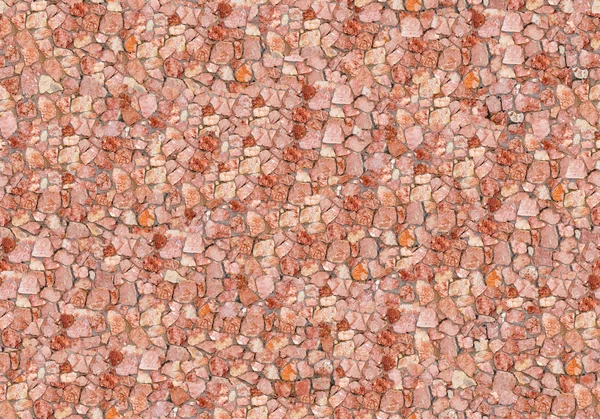 Muro di pietra rossa senza cuciture . — Foto Stock