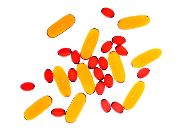 Transparent yellow and red capsules. — Stock Photo, Image