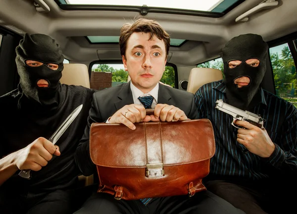 Businessman grasped in hostages. — Stock Photo, Image