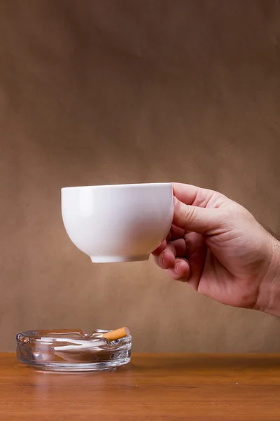 Hand holding a cup — Stock Photo, Image