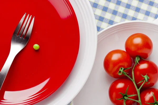 Tomatoes and a Pea — Stock Photo, Image
