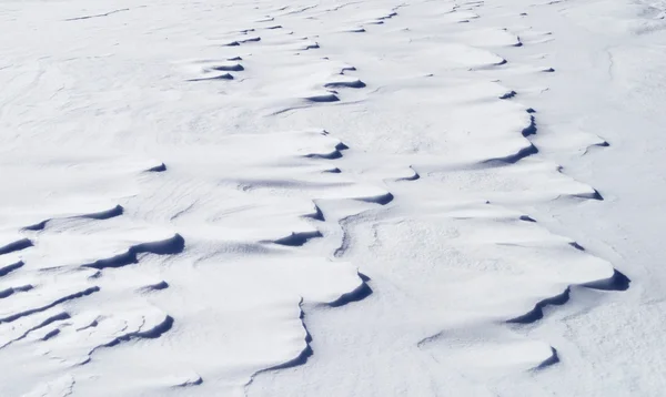 風が雪の表面の背景 — ストック写真