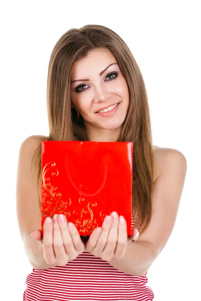 Portrait of beautiful young woman with gift — Stock Photo, Image