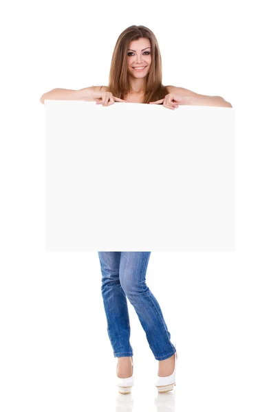 Happy young woman holding a blank billboard — Stock Photo, Image