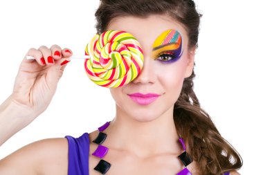 Portrait of a glamourous beautiful woman holding lollipop clipart