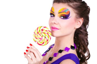 Portrait of a glamourous beautiful woman holding lollipop clipart