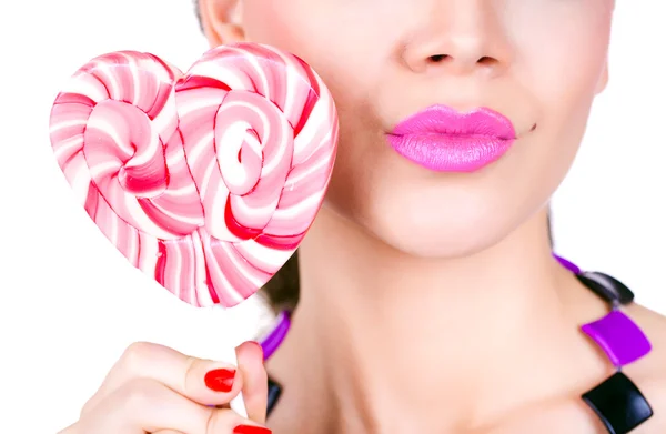 Portrait of a glamourous beautiful woman holding lollipop — Stock Photo, Image