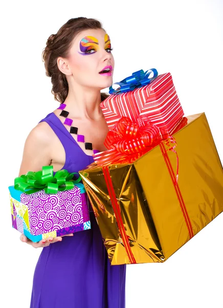 Beautiful woman with make up in dress with gifts — Stock Photo, Image