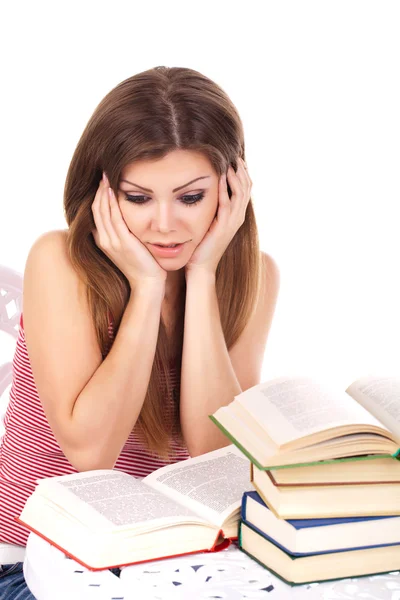Mulher estudante com uma pilha de livros, isolado em branco — Fotografia de Stock
