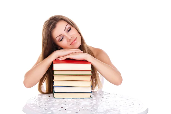 Femme étudiante avec une pile de livres, isolée sur blanc — Photo