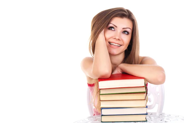 Bir kitap, üzerinde beyaz izole yığını ile öğrenci kadın — Stok fotoğraf
