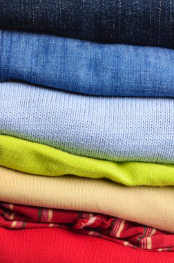 Stack of multicolored men's clothing clipart