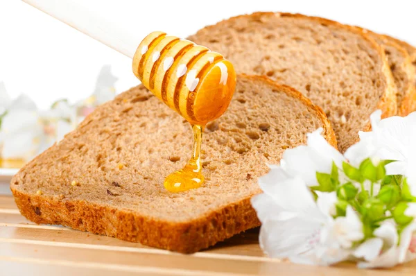 Honing en brood — Stockfoto